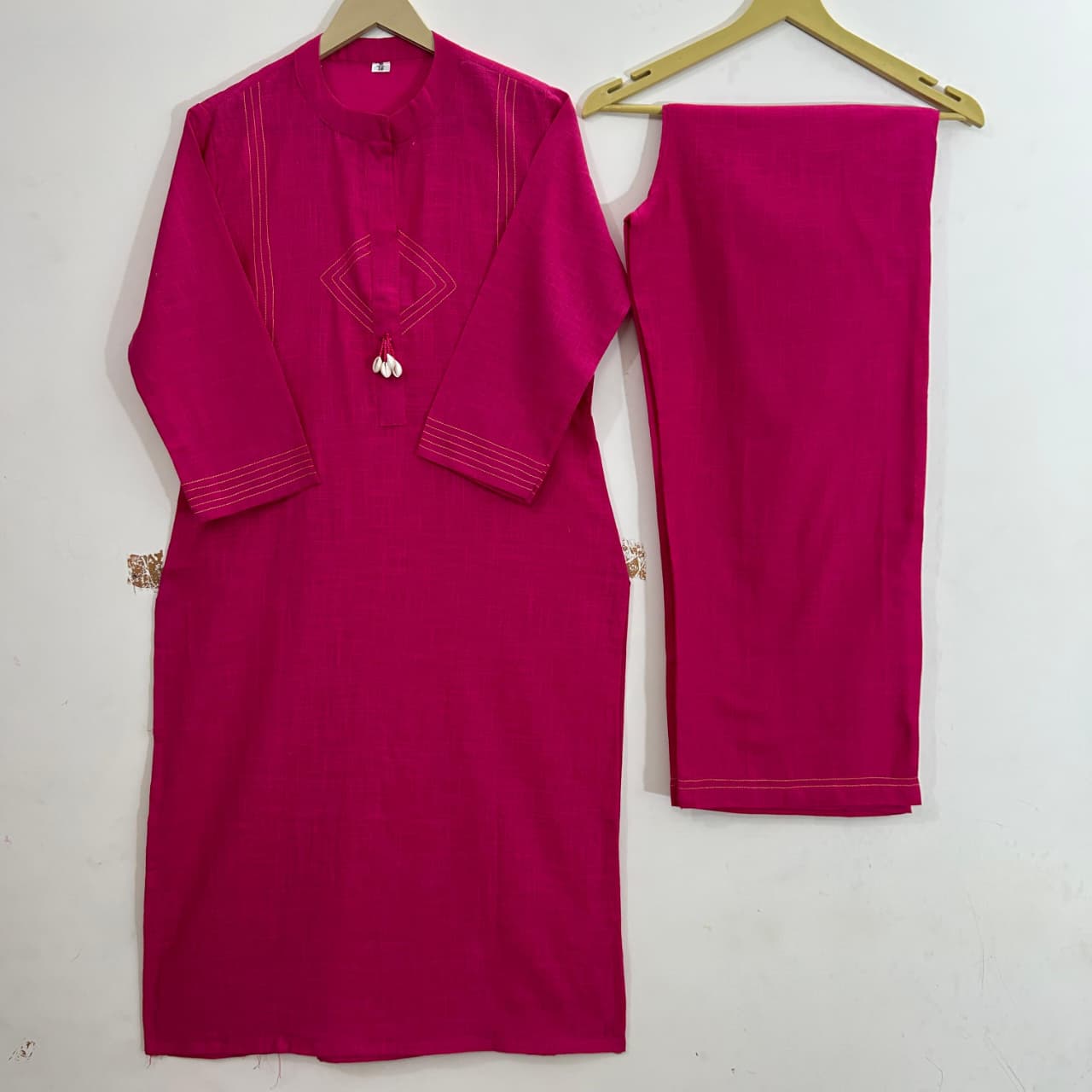 Pure cotton, clean lines, and just the right pop of pink Cord Set
