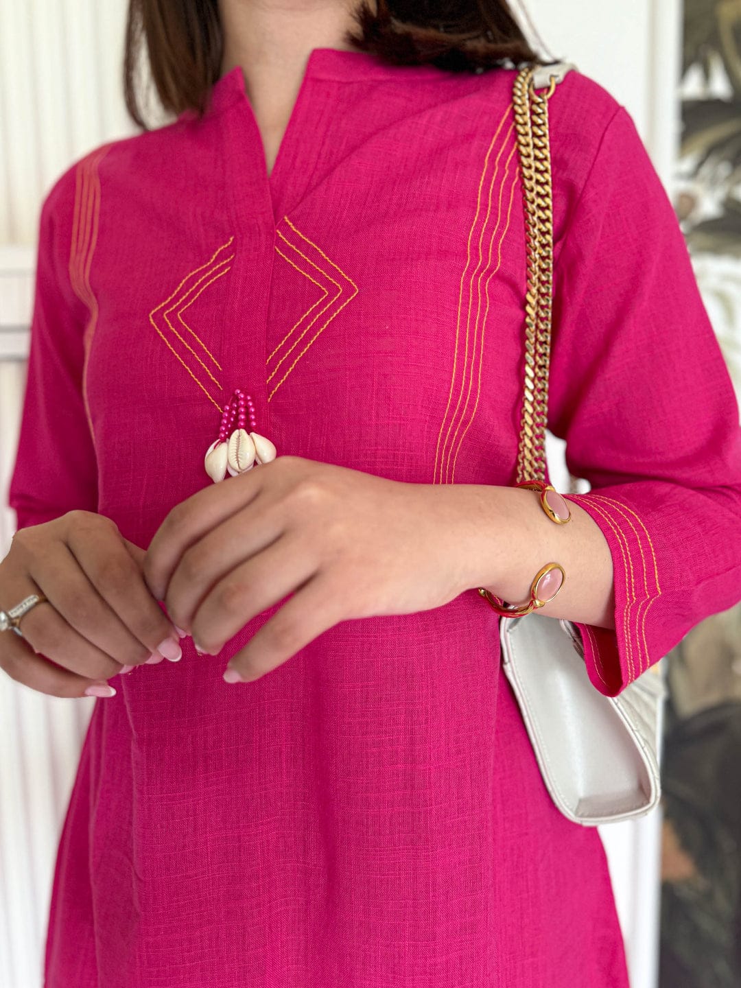 Pure cotton, clean lines, and just the right pop of pink Cord Set